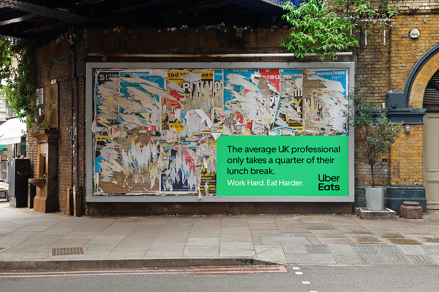 Uber Eats poster on a torn flyposting wall